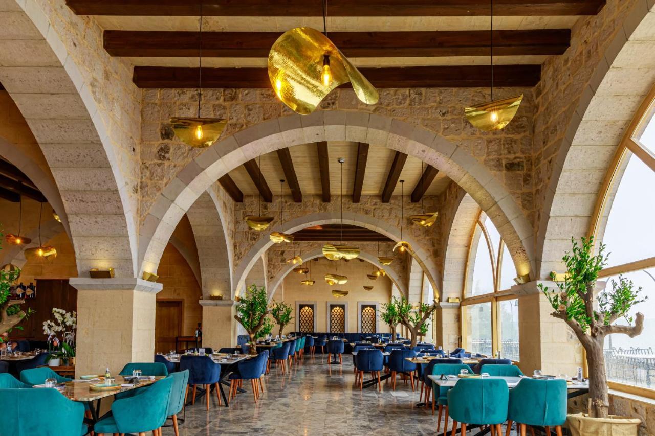 Millstone Cave Suites Hotel Учисар Экстерьер фото